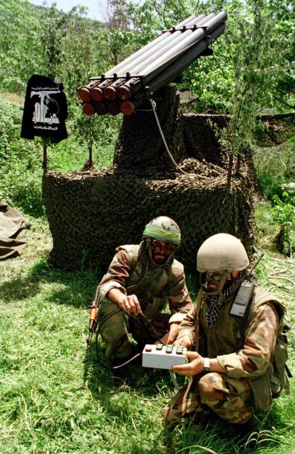 Хезболла
Two Hezbollah, or party of God fighters, work on the Katyusha rockets during a daily training in one of Hezbollah\\\'s hideouts in south Lebanon, Jan. 9, 2000. While Syria and Israel are talking peace now, the language of Hezbollah guerrillas is that of war, but eventually with a settlement, Hezbollah will have little choice but to lay down their arms and turn to politics. A peace between Israel and Syria, which has great control over Lebanon, would deny Hezbollah the use of this country as a staging ground for anti-Israeli military operations. (AP Photo/Mohammed Zatari)