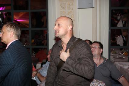 22 июня 2010 года. Ресторан Marusya. 32-й Московский международный кинофестиваль (ММКФ). Церемония вручения премии Beauty Cinema Awards. На снимке: музыкант, актер Гоша Куценко.