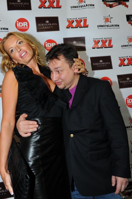 Вручение премии \"Роковая женщина\" от журнала XXL. На снимке глава пиар-агентства \"Constellation by Olga Rodionova\" Ольга Родионова и продюсер Александр Изотов. Москва. 29 сентября 2011 года.