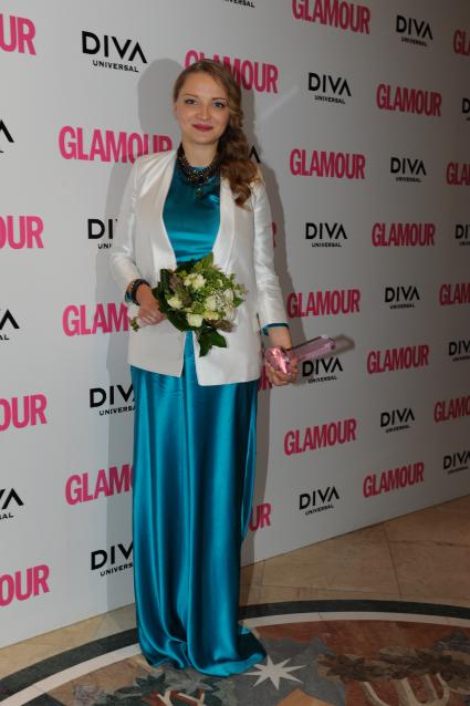 Церемония вручения премии ЖЕНЩИНА ГОДА ЖУРНАЛА GLAMOUR 2011. На снимке: актриса Екатерина Вилкова, получившая премию в номинации ЖЕНЩИНА ГОДА. 17 ноября 2011 года.