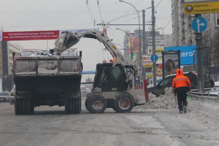 Снегоуборочная техника на улицах города.