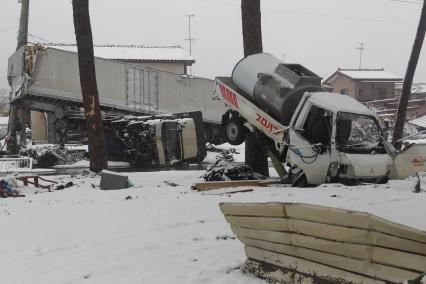 Сильнейшее землетрясение и цунами в Японии. Общий вид на разрушения.