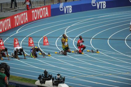 СК `Лужники`.  Чемпионат мира по легкой атлетике 2013.  Бег. 100 метров. Мужчины. На снимке (2-ой справа): спортсмен Усейн Болт (Ямайка).