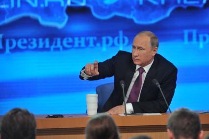 Большая пресс-конференция президента РФ Владимира Путина (на снимке) в Центре международной торговли.