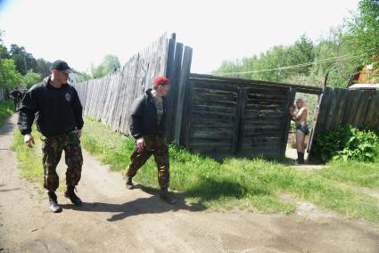 Сотрудники полиции отряда ОМОН, во время прохождения квалификационного испытания на право ношения Черного берета. База ОМОН. Екатеринбург