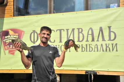 Московская область, д. Мисайлово.   Участник фестиваля семейной рыбалки с радио `Комсомольская правда` в парке рыбалки и отдыха `Лагуна`.