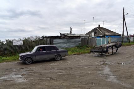 Новосибирск. Мужчина в автомобиле  ВАЗ 2107 на одной из улиц.