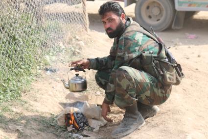 Сирия, Восточная Гута. Сирийские военные в поселении Хаммурия.