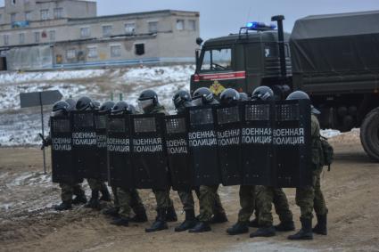 Екатеринбург. Свердловский полигон. Военнослужащий армии государств-членов ОДКБ (Организация Договора о коллективной безопасности) во время совместных учений миротворческих сил \'Нерушимое братство – 2018\'