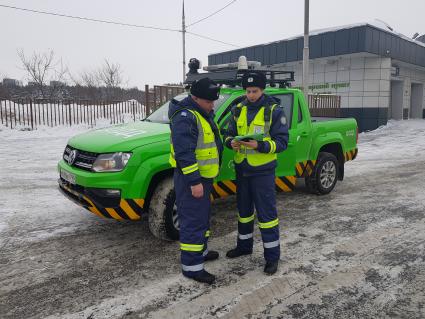 Москва. Сотрудники дорожного патруля Центра организации дорожного движения (ЦОДД) на одной из улиц города.