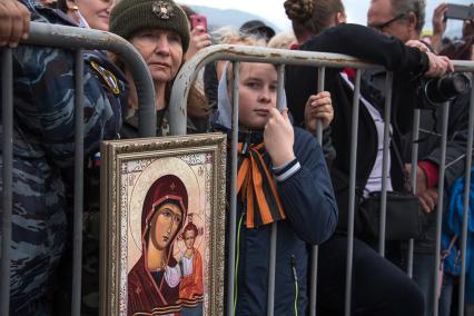 Крым, Симферополь.  Во время праздничного мероприятия, посвященного пятой годовщины проведения Общекрымского референдума и воссоединения Крыма с Россией, после окончания автопробега на горе Гасфорта.