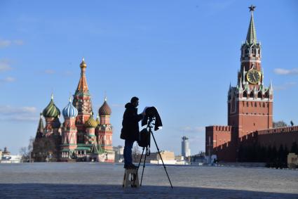 Москва. Фотограф на Красной площади.