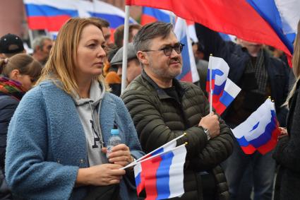 Москва. Зрители на митинге-концерте в поддержку присоединения к России ЛНР, ДНР, Херсонской и Запорожской областей на Красной площади.