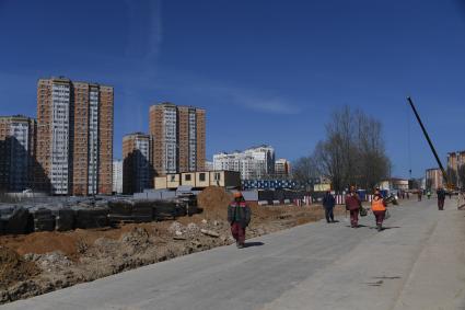 Москва.  Рабочие на строительной площадке станции `Физтех` Люблино-Дмитровской линии Московского метрополитена.