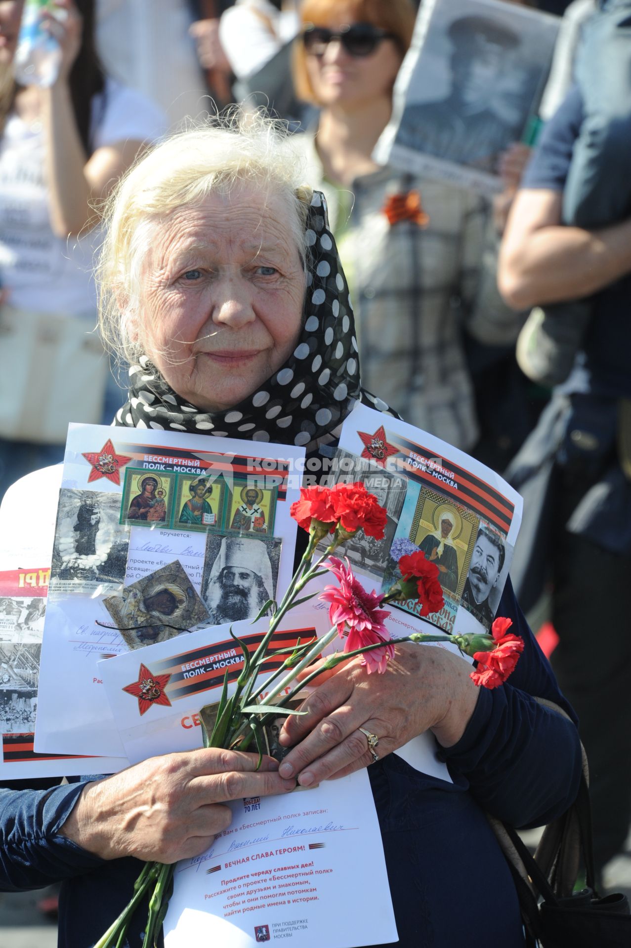 Москва. Участники акции `Бессмертный полк`, посвященной 70-летию Победы в Великой Отечественной войне на Красной площади.