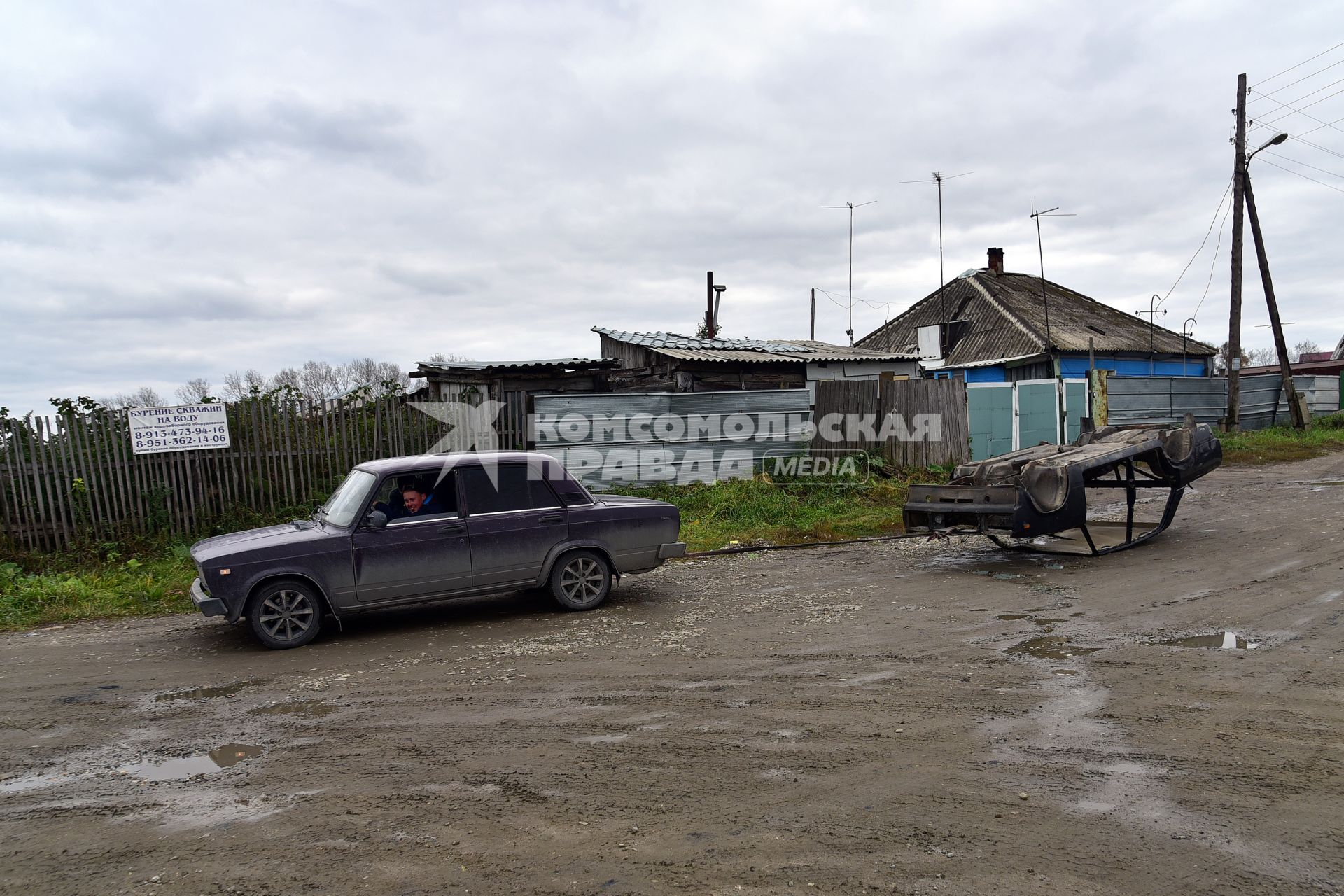 Новосибирск. Мужчина в автомобиле  ВАЗ 2107 на одной из улиц.