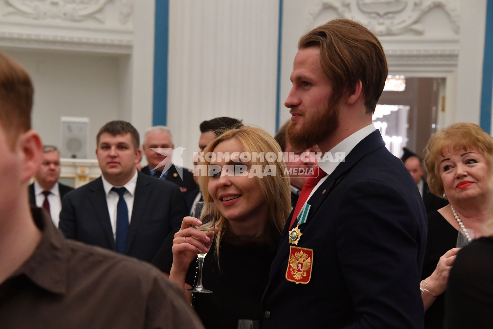 Москва. Олимпийский чемпион по хоккею Иван Телегин и его супруга певица Пелагея на приеме в Кремле после церемонии вручения государственных наград победителям и призерам XXIII зимних Олимпийских игр в Пхенчхане.