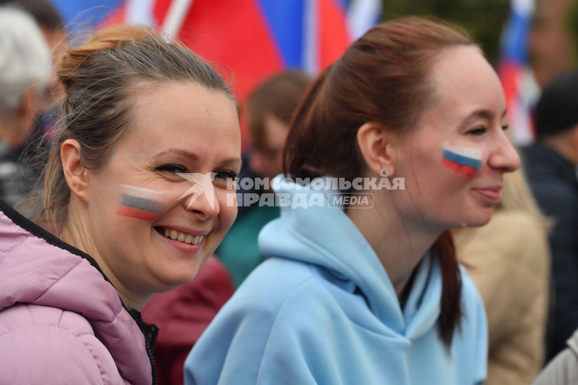 Москва. Зрители на митинге-концерте в поддержку присоединения к России ЛНР, ДНР, Херсонской и Запорожской областей на Красной площади.